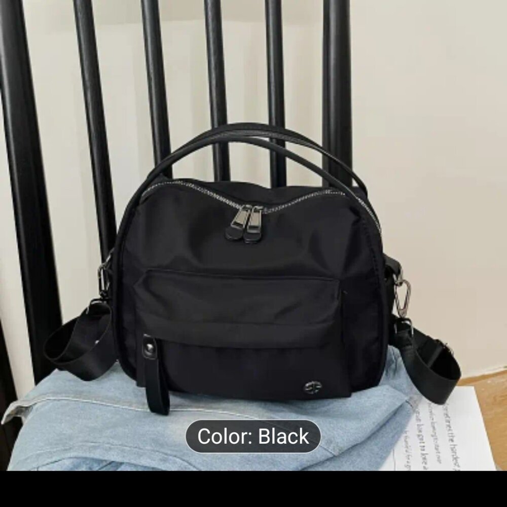BLACK NYLON HAND BAG.